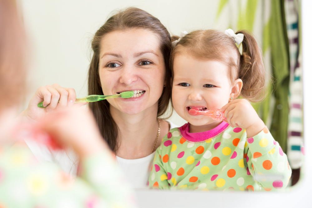 Mother,Teaching,Kid,Teeth,Brushing,In,Bathroom